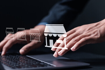 Franchise marketing concept. Franchise network business marketing plan for branch growth and expansion. Businessman use laptop with franchise business icon on virtual screen.