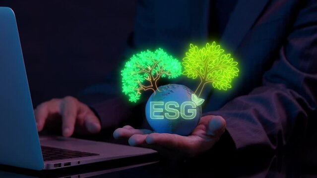 Businessman shows earth global with ESG icon and virtual tree. Net zero greenhouse gas emissions target. Climate neutral long term strategy. Ecological, renewable energy and save environment concept.
