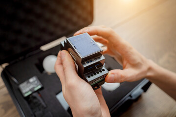 A technician works with a demo kit of the smart home system