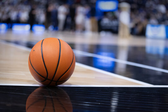 Basketball resting on a court during a big championship game. Copy space and great basketball concept photo