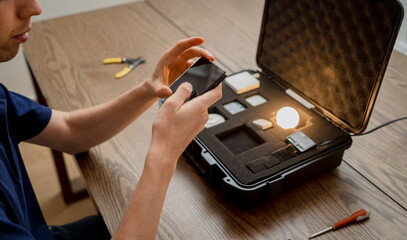 A technician works with a demo kit of the smart home system