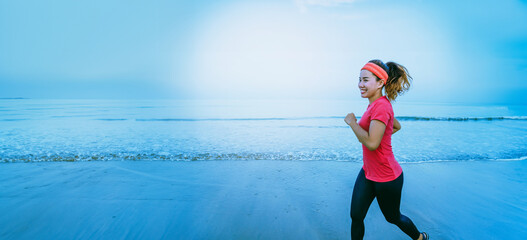 Woman jogging workout on the beach in the morning. Relax with the sea walk. in summer - 754694100