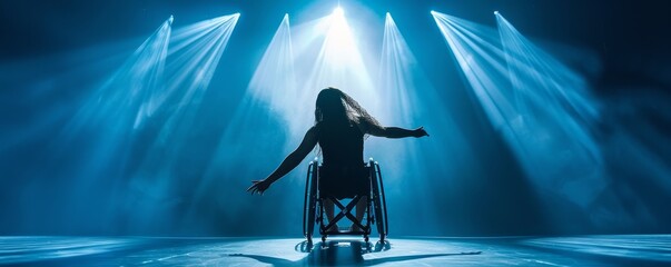 A powerful wheelchair dancer captivates under stage lights in a modern dance performance. - obrazy, fototapety, plakaty