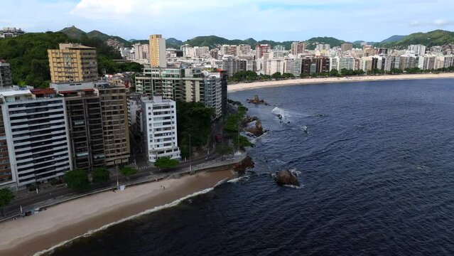 Aerial shot drone flies past Flechas beach toward Icara&iacute; beach in Niter&oacute;i