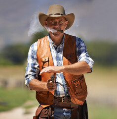 Cowboy, portrait and aim gun to shoot for standoff or gunfight in duel for wild western culture in...