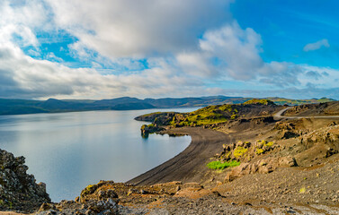 Icelandic colorful and wild landscape with volcanic black sand beach at the Kleifarvatn lake at summer time, Iceland