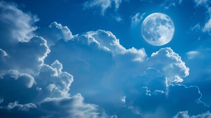 Naklejka na ściany i meble Moonlight on a cloudy blue sky