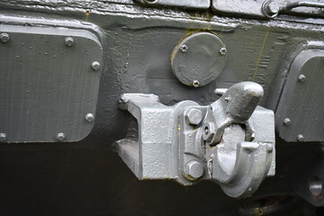 Pintle hook attachment on rear of military tank.