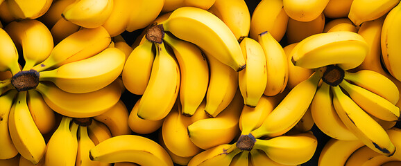 bananas background. Fresh banana yellow background in the fruit market - obrazy, fototapety, plakaty