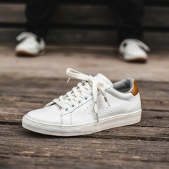 White sneakers on dark wooden surface. Shoes for women in sport fashion style.