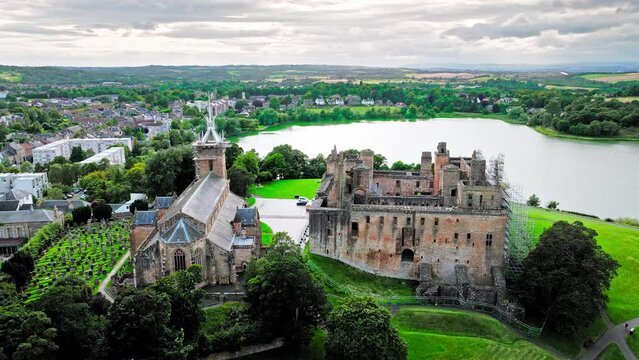 Aerial view of Linlithgow Palace, the ruins of medieval birthplace of Mary Queen of Scots. Scottish Tourist attraction on a low hill above a small inland loch in Scotland.