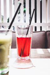 Cold matcha tea on a table in a cafe. Summer cold drinks.