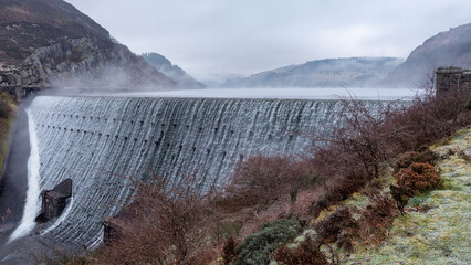 Caban Coch waterfall early morning with mist rising. One of the waterfalls in the elan valley,...