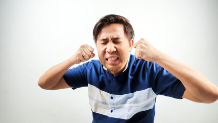 Portrait of Asian Man in blue and white shirt showing crying,sad expression isolated on white...