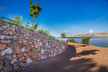 Texture of a fence in macro made of natural stone in the mountains