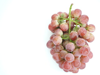 Red grape placed on a white background.