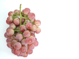 Red grape placed on a white background.