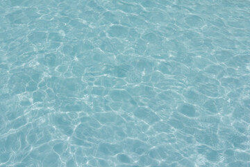 The light reflects blue in the water in the swimming pool. It looks fresh and lively, suitable for use as a wallpaper.