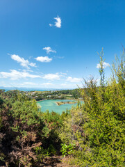 Fototapeta na wymiar Iconic Beauty of Kaiteriteri Beach: A Panoramic View of its Golden Sands and Crystal-Clear Waters, a Beloved Summer Destination in New Zealand