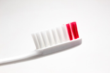 Red toothbrush isolated on white background
