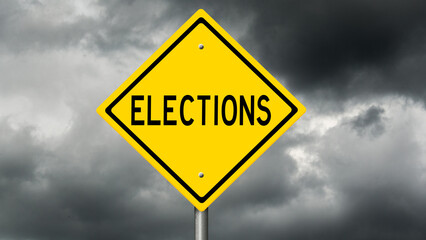 Yellow diamond highway sign with dark clouds with message "Elections"