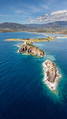 Panorama of the coast of Pula in Sardinia. Crystal clear sea and clouds in the distance