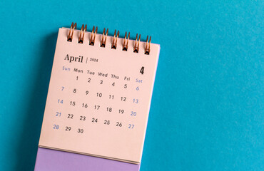 Calendar for planning for April 2024 on a blue background.