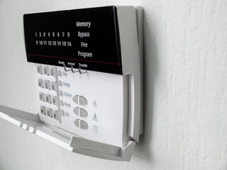 alarm control panel on the light wall of the room, Isolated