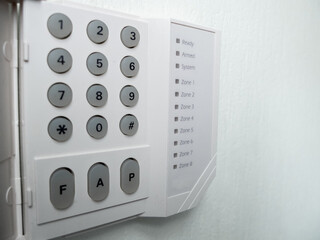 alarm control panel on the light wall of the room, Isolated