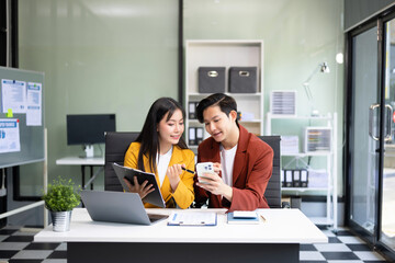 Portrait of success business people working together in office. Couple teamwork startup concept