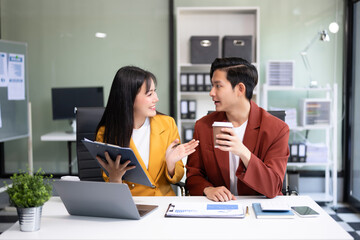 Portrait of success business people working together in office. Couple teamwork startup concept