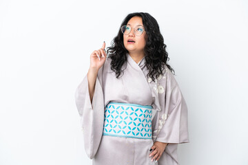 Young asian woman wearing kimono isolated on white background thinking an idea pointing the finger up