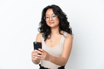 Young asian woman isolated on white background sending a message or email with the mobile