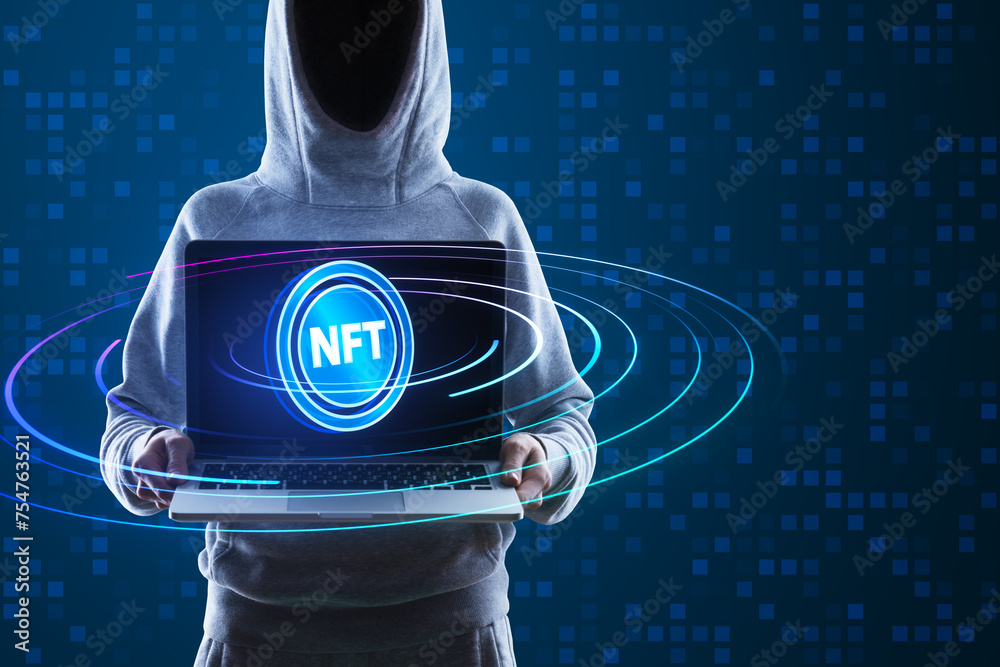 Poster hacker in hoodie holding laptop with creative round nft hologram on digital blue backdrop. non-fungi