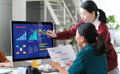   Asian women discussing about business plan, Asia female team analyze business data at office