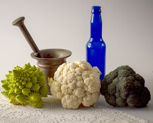still life on a light background, various objects, healthy organic vegetables