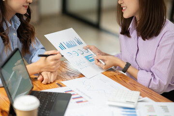 Asian business woman working and talking at the office
