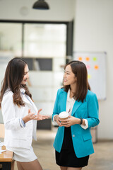 Asian business woman working and talking at the office
