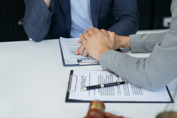 Fototapeta premium Lawyer or Legal advisers encourage clients.encouraged the client after discussing the terms of the contract.