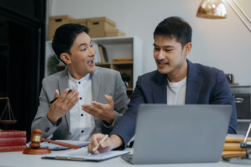 Teamwork of business lawyer meeting working hard about legal legislation in courtroom to help their customer..