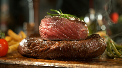A view of a fresh beef steak on a wooden board placed on the kitchen counter. The concept of meat preparation.