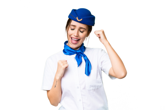 Airplane stewardess over isolated chroma key background celebrating a victory - Powered by Adobe