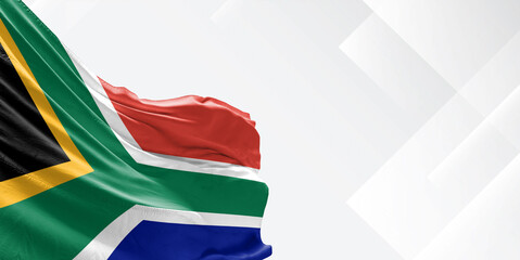 South Africa national flag cloth fabric waving on beautiful white Background.