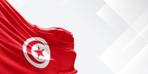 Tunisia national flag cloth fabric waving on beautiful white Background.