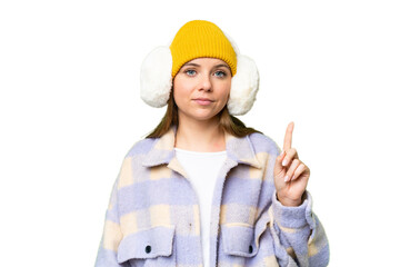 Young blonde woman wearing winter muffs over isolated chroma key background pointing with the index finger a great idea