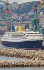Classic historic ocean liner cruiseship cruise ship in wet dry dock for maintenance refurb...