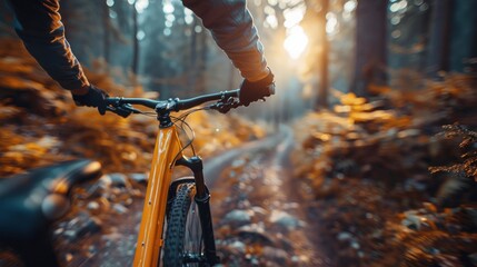Mountain biker cyclist riding a bicycle downhill on a mountain bike trail. Outdoor recreational lifestyle adventure sport activity