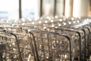 Empty airport baggage trolleys parked at the airport.