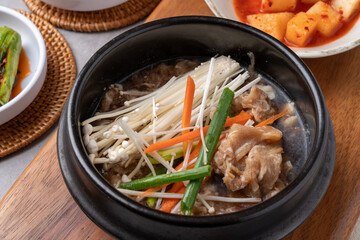 Korean food, budae jjigae, galbitang, earthen pot, bulgogi, pork belly, grilled, side dishes, kimchi, cucumbers, potatoes, vegetables