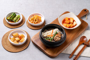 Korean food, budae jjigae, galbitang, earthen pot, bulgogi, pork belly, grilled, side dishes, kimchi, cucumbers, potatoes, vegetables